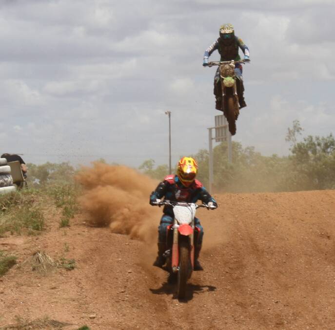 BIG BERMS: Members in the senior division get their first dirt bike practice of the year, making the most of the bumps in the track. Photo: Esther MacIntyre