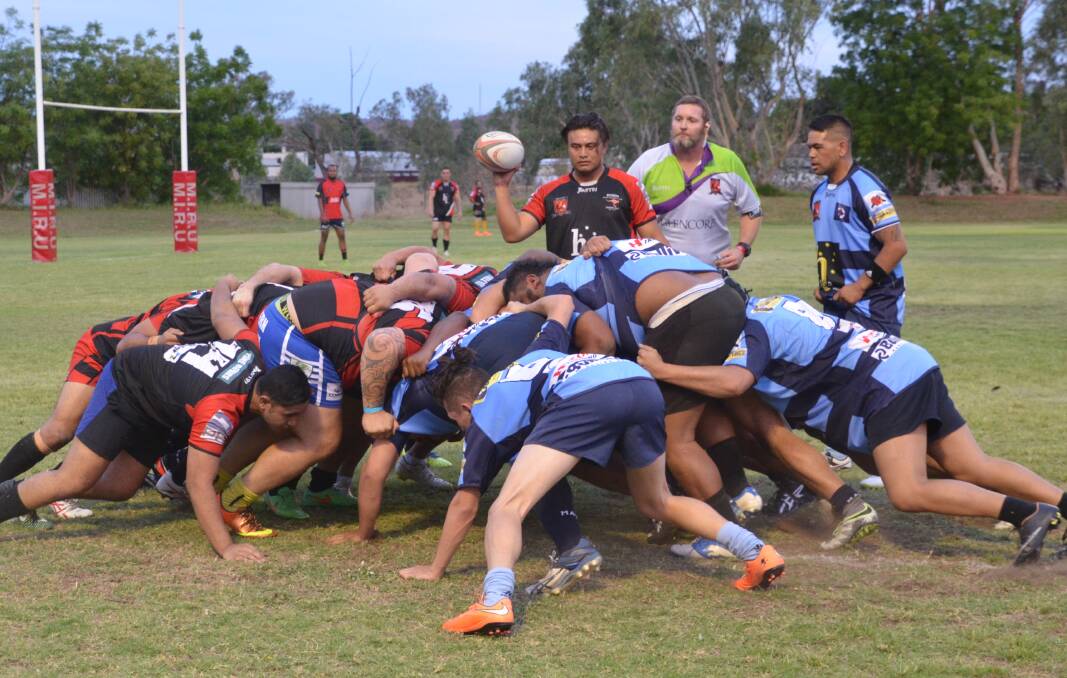 RED VS BLUE: Mount Isa Rugby Union team Keas (blue) beat Euros (red) with a score of 28-10 at Rugby Park on Saturday night, before Warrigals beat Cloncurry 66-7. Photo: Esther MacIntyre 
