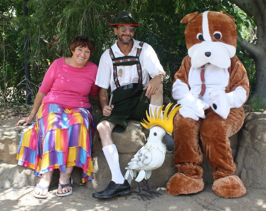 Paws committee members Sue Carson, Peter Shorter, and Tammy Shorter as dog.