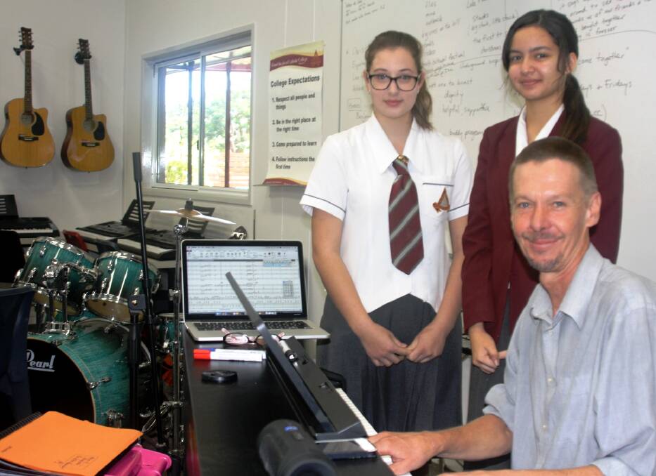 Year 11 Music students Sophia Mileska and Isabella Fahey learn composition and performance from Topology artist, composer, and saxophonist, John Babbage.