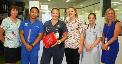 Choccies for the hard-working ED nurses, with CE Lisa Davies Jones (right). Photo: NWHHS