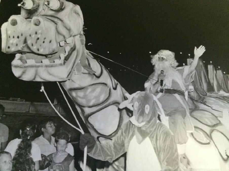Sometimes in the early 1980s, Santa hitched a ride to Mount Isa Mines' Christmas Tree on his friendly Outback dinosaur. 