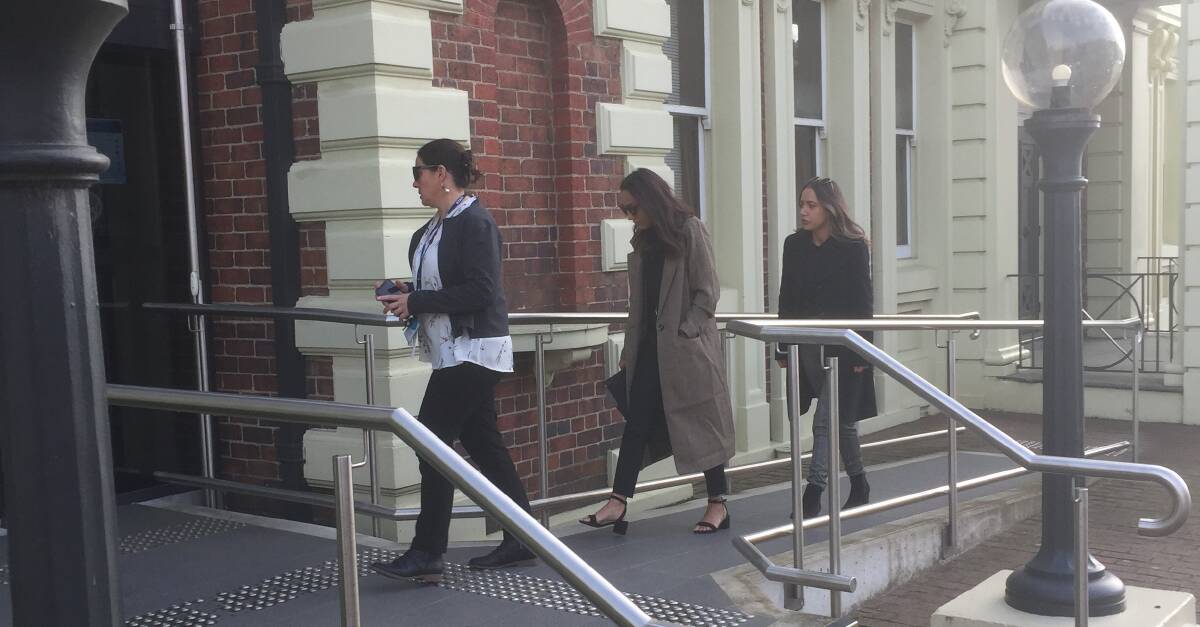 Katlyn Roney (centre) enters the Launceston Supreme Court yesterday morning.
