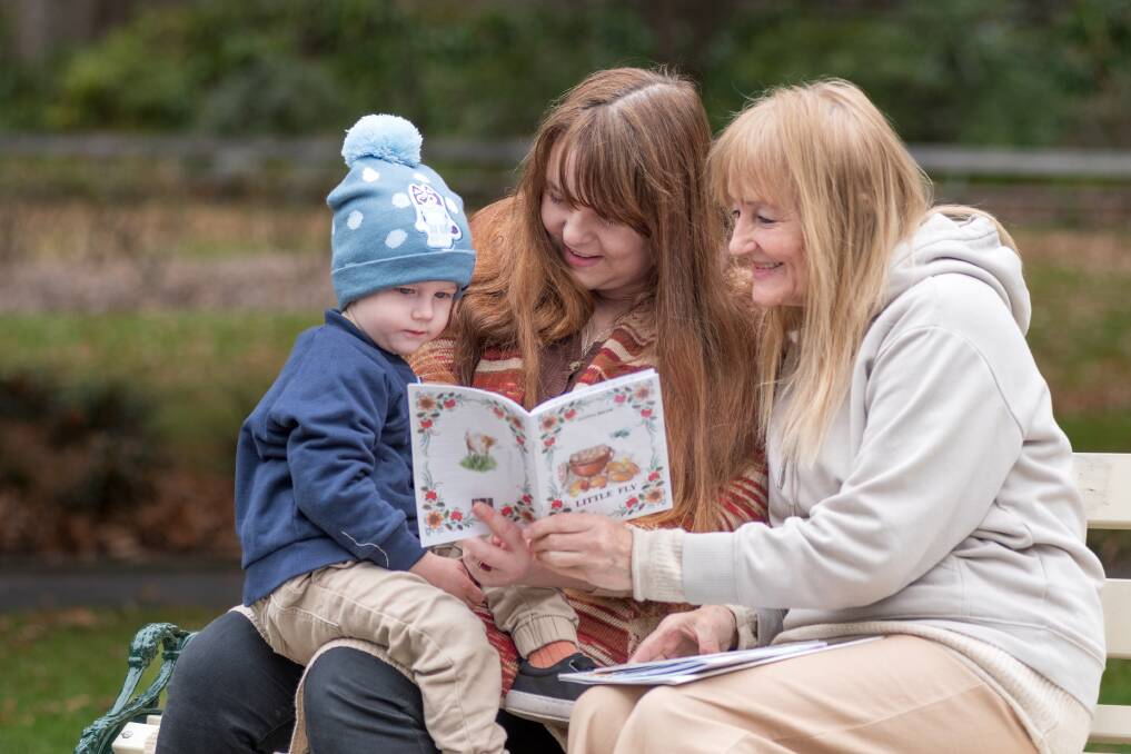 Ukrainian children's author and refugee Hanna Bilyk with daughter Iryna Bohlscheid and grandson Clyde Bohlscheid, 2. Picture: Phillip Biggs