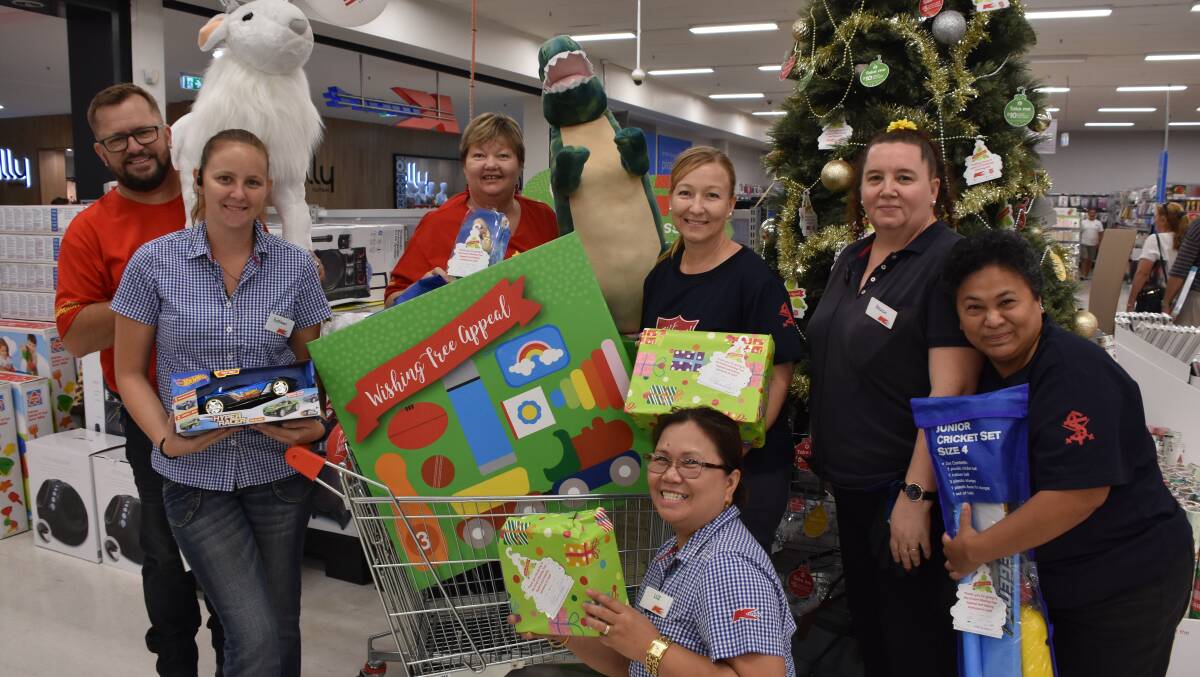 CHRISTMAS PICK UP: The firat of many toy pick ups by the Salvo's at the Kmart Wishing Tree. Photo: Melissa North