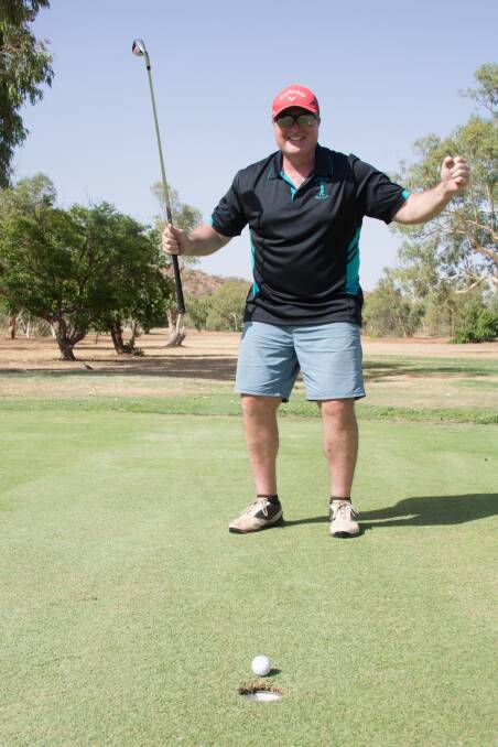 HOLE IN ONE: Shane Moncrieff got excited as the golf ball rolled toward the hole. Photo: Melissa North