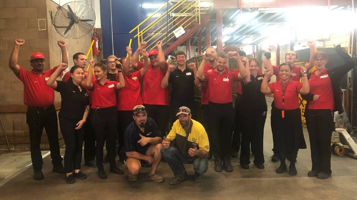 HERO'S WELCOME: The Mount Isa team celebrate with truckies Craig and Bill. Photo: Supplied