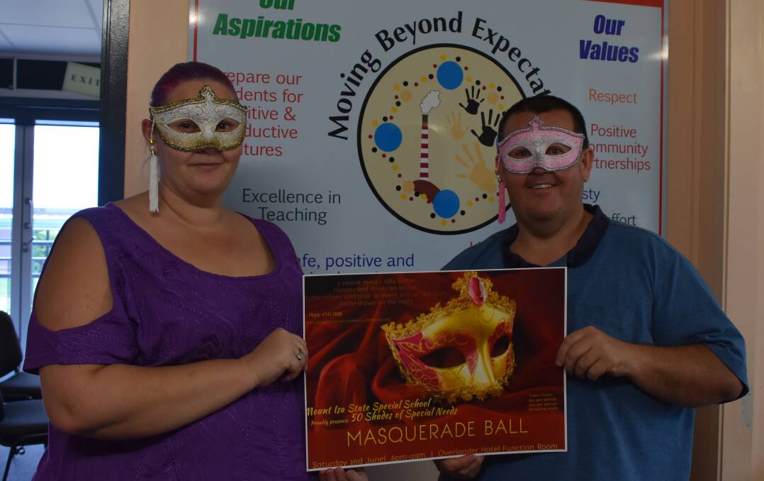 MASKED UP: P&C president Sue McBride and principal Geoff Miller are excited about the upcoming ball. Photo: Melissa North