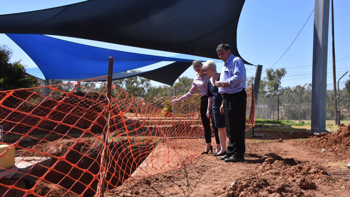 Director of Engineering Services Emilio Cianetti, Councillor Peta McRae and Mount Isa Mayor Joyce McCulloch inspect the extensive leaks found after further investigation into the refurbishment of the pool.