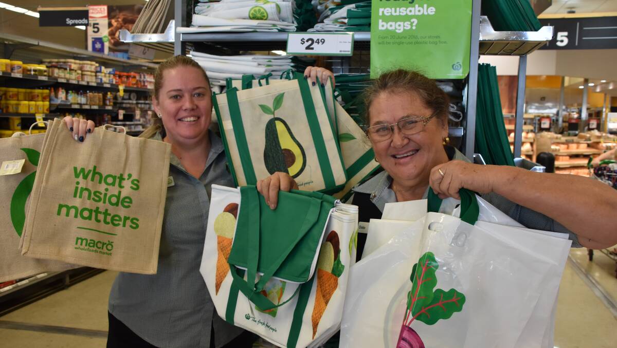 GREENER FUTURE: Sheree Pfrunder and Dale Johnson from Woolworths Mount Isa display the options available to customers in the lead up to June 20.