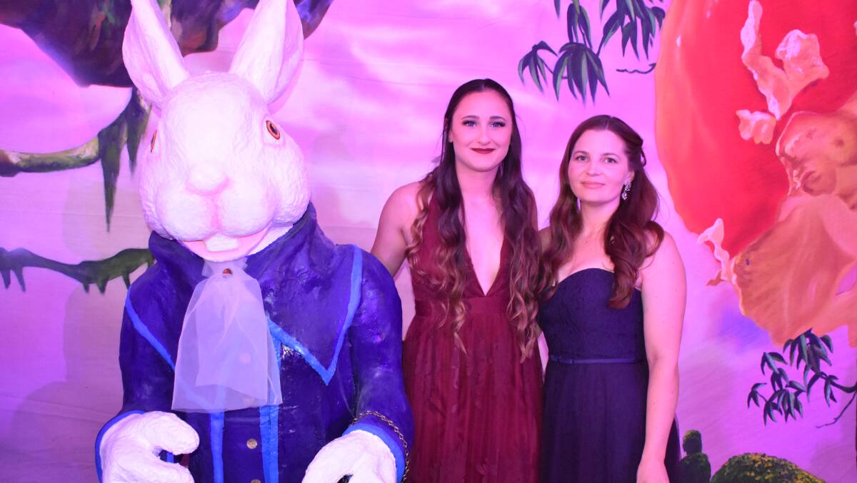 CHARITY BALL: Karly and Megan posed with the white rabbit at the Alice in Wonderland themed Charity gala event. Photos: Melissa north