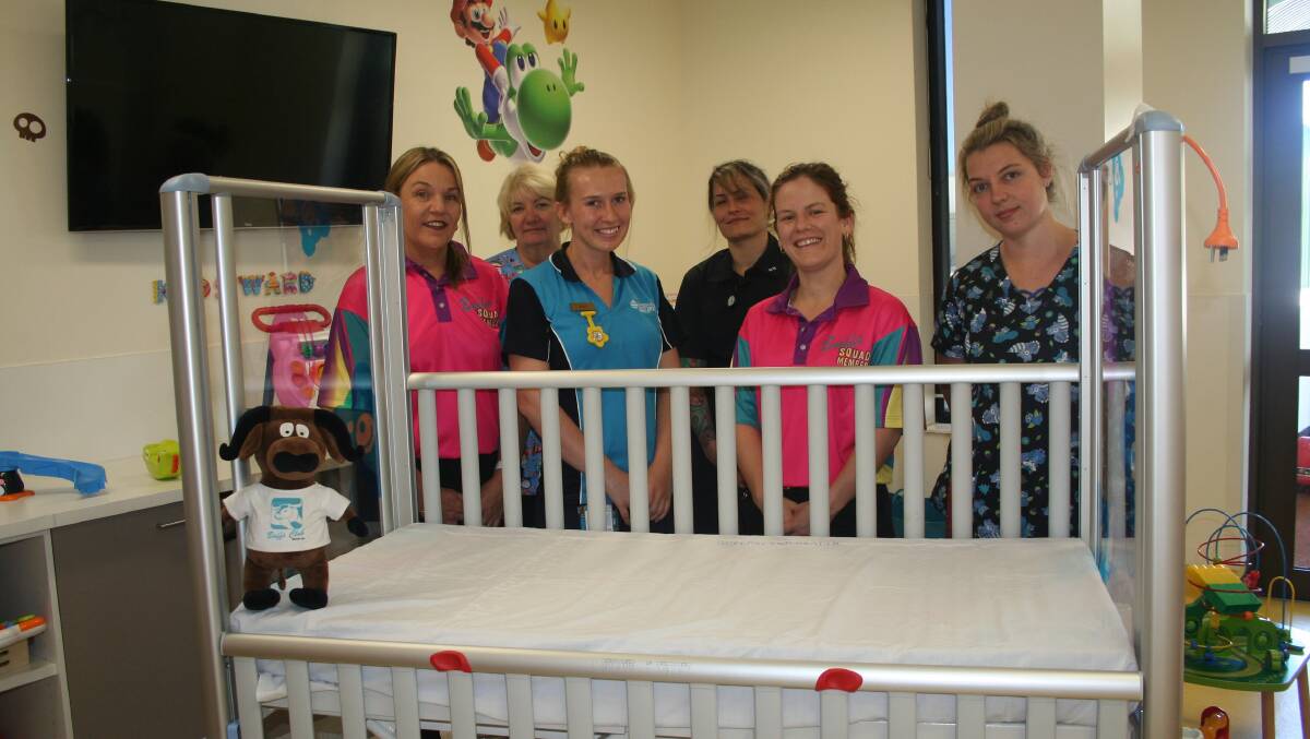 FUNDS RAISED: Children’s Ward Staff and Buffs Club’s Karen Graham and Brook Donnelly in pink shirts.