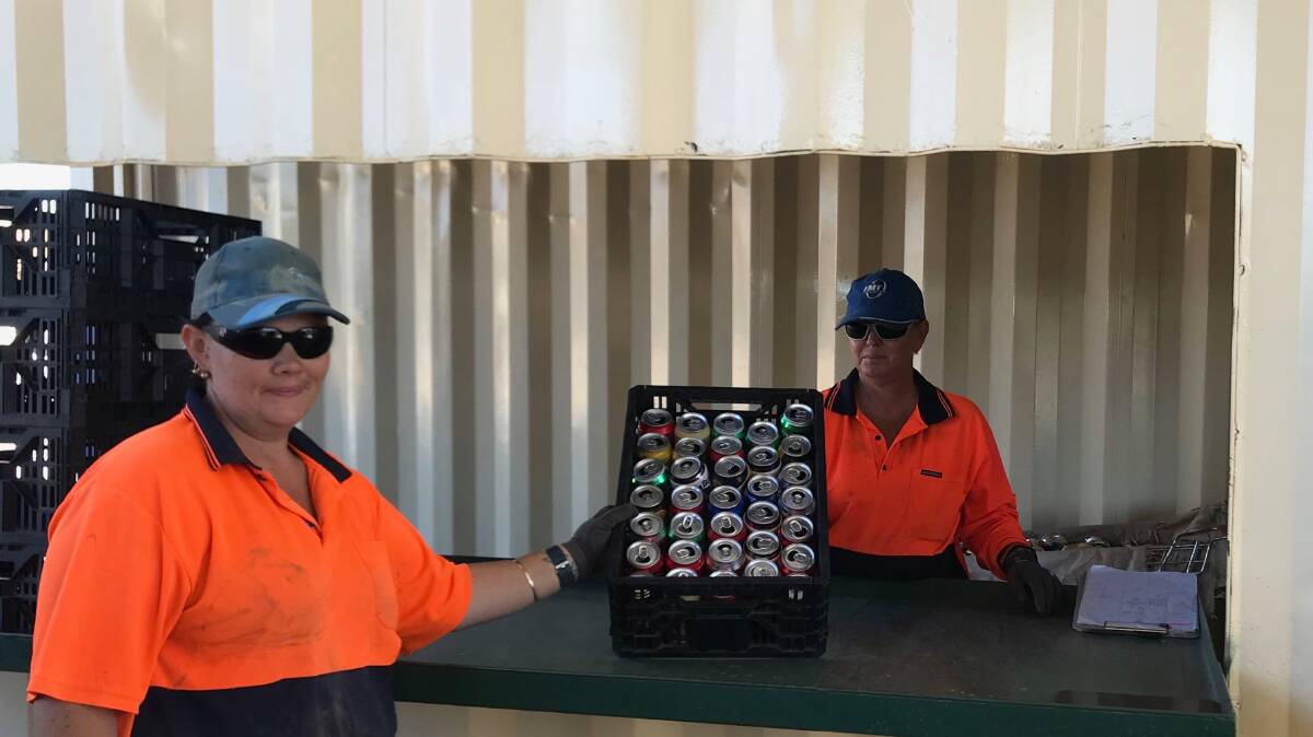 RECYCLING: Mt Isa Metal Recylers staff members Kelly Jones and Esmeralda Smith at the counting table. Photos: Supplied