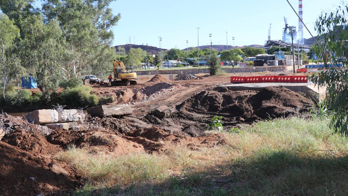 ISA ST BRIDGE: Rubble was bulldozed away from the Leichhardt riverbed after the Isa St bridge was demolished last week. Photo: Supplied