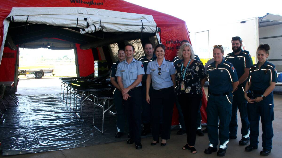 FIELD HOSPITAL: Queensland Ambulance staff and NWHHS Executive Director Nursing and Midwifery and Clinical Services, Michelle Garner (centre), with the pop up field clinic at Buchanan Park.