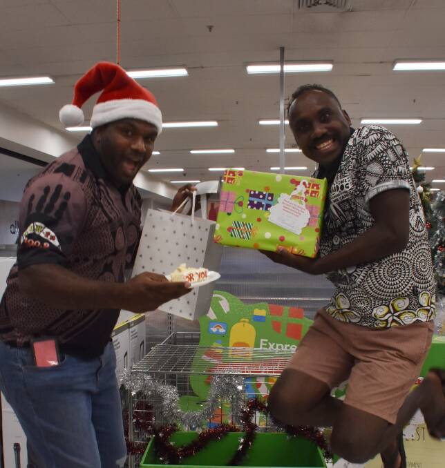 CHRISTMAS EXCITEMENT: Joshua and TuTu from Mob FM entertained the shoppers with music and festive hijinx on Monday morning at Kmart. Photo: Melissa North
