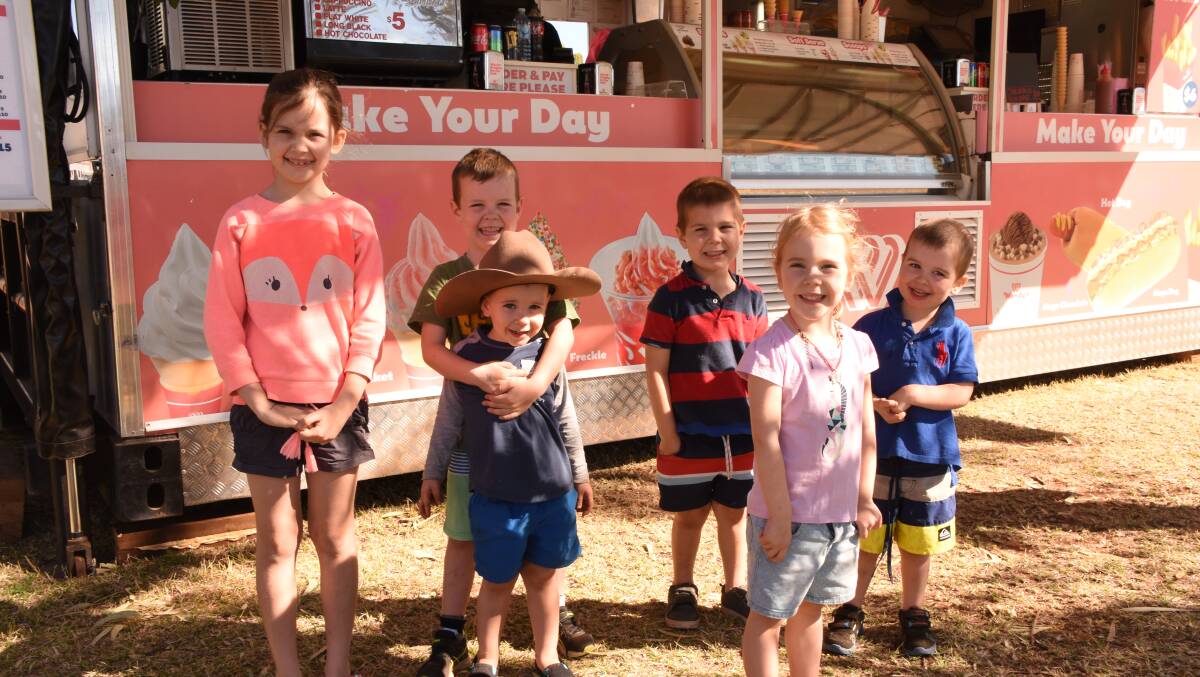 ICE CREAM: Lucy, Indi, Charlie, Jeffrey, William and Thomas Daniels were keen for an ice cream after looking at the many stalls. Photos: Melissa North
