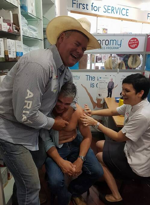 HEADLOCK: Shane Kenny held Robbie Katter in a neck lock so he couldn't get away. Photo: Melissa North
