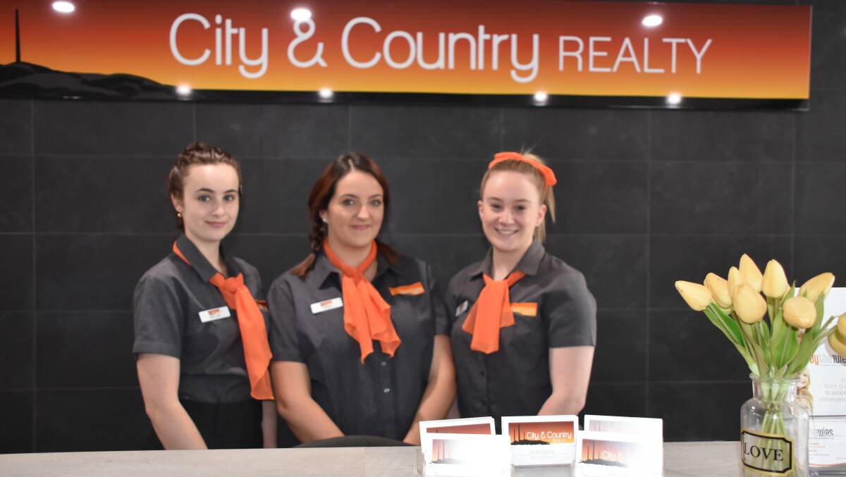 CITY AND COUNTRY REALTY: Kellie Patava, Bree Gleeson and Sarah Jeffery are the first point of call at reception. Photo: Melissa North