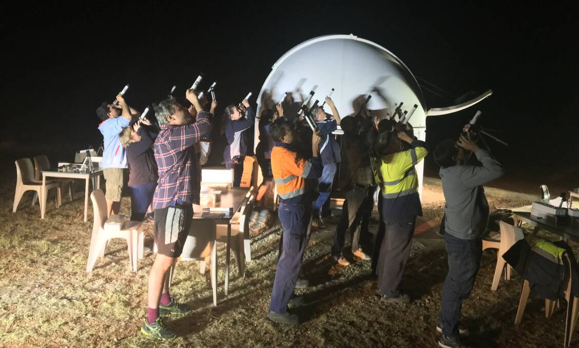 ASTRONOMERS: About 21 amateur astronomers from Incitec Pivot at Phosphate Hill gathered to look at the sky in an attempt to help break the current world record. Photo: Supplied