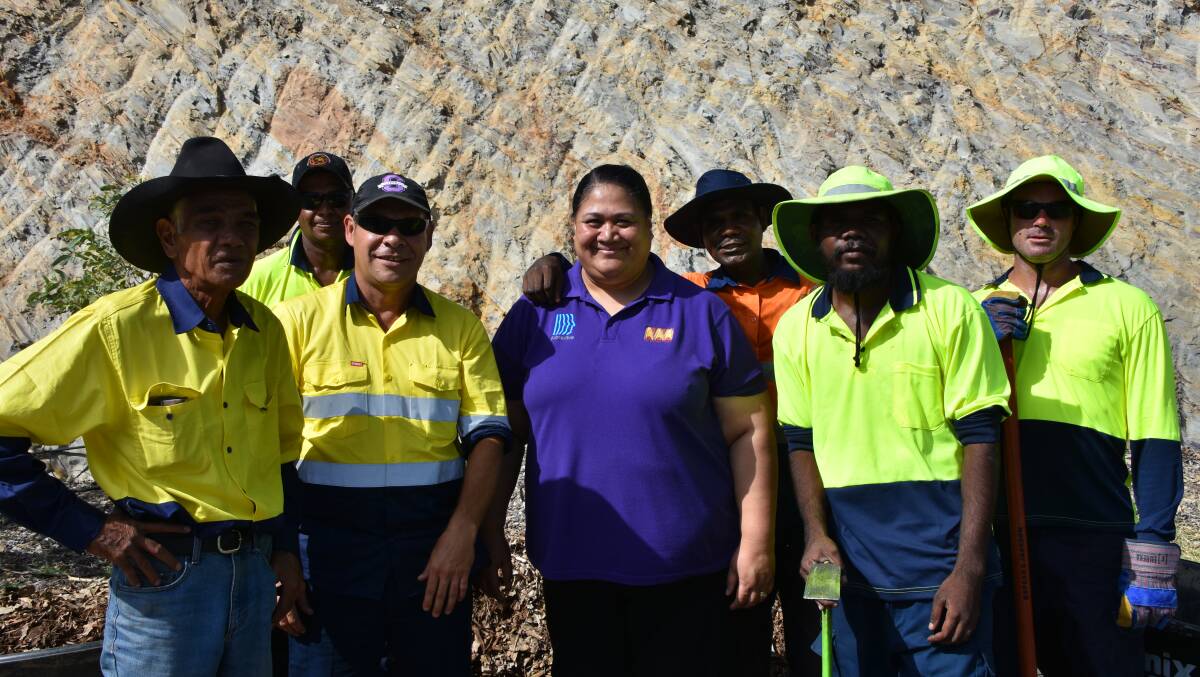 RAINBOW GATEWAY: Supervisors, workers and Ms Leuluaialii stopped work for a photo.