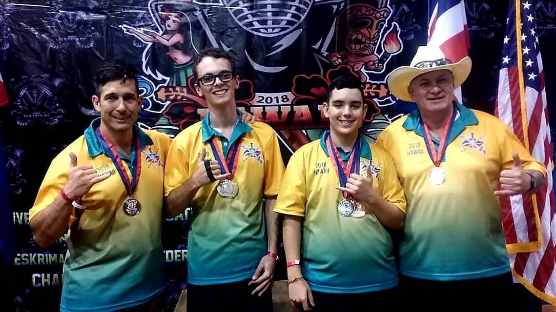 SIKARAN STUDENTS: Dallas Farnsworth, Zane Street, Patrick Roche and Christopher Roche celebrate their medal haul in Hawaii after learning the discipline of Martial Arts.
