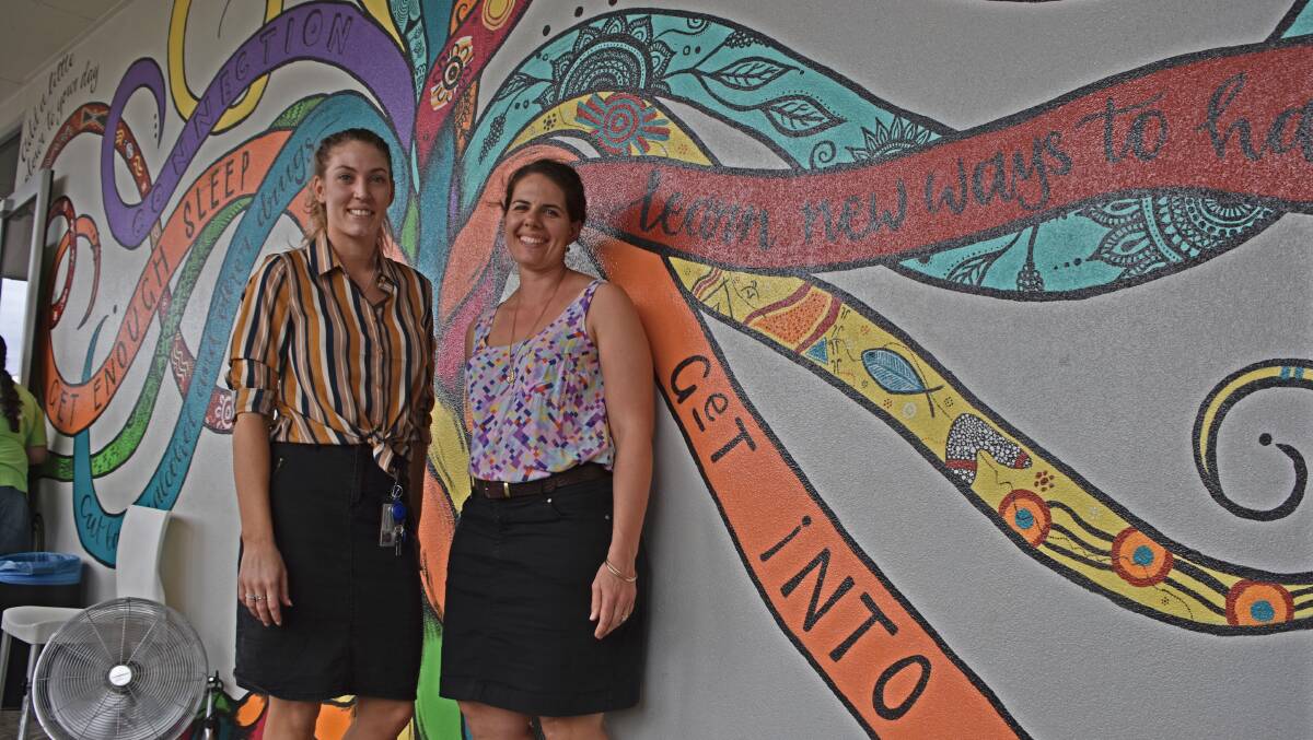 HEADSPACE: Stephanie Campbell and Ciemon Scotney painted The Colour Tree for National Headspace Day symbolising seven tips for mental health. Photo: Melissa North