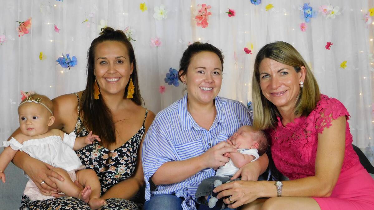 FAMILIES: Mayor Joyce McCulloch, right, with two new Mount Isa mums at last year’s
Welcoming Babies Day. Photo: Supplied