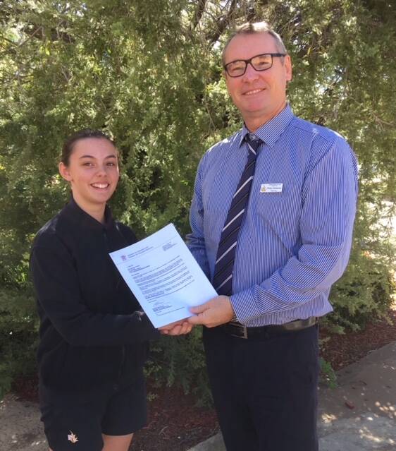 Youth Perspective: Kathleen Farrelly is congratulated by Spinifex State College Principal Phil Sweeney after being invited to voice her perspective on youth issues. Photo: Supplied