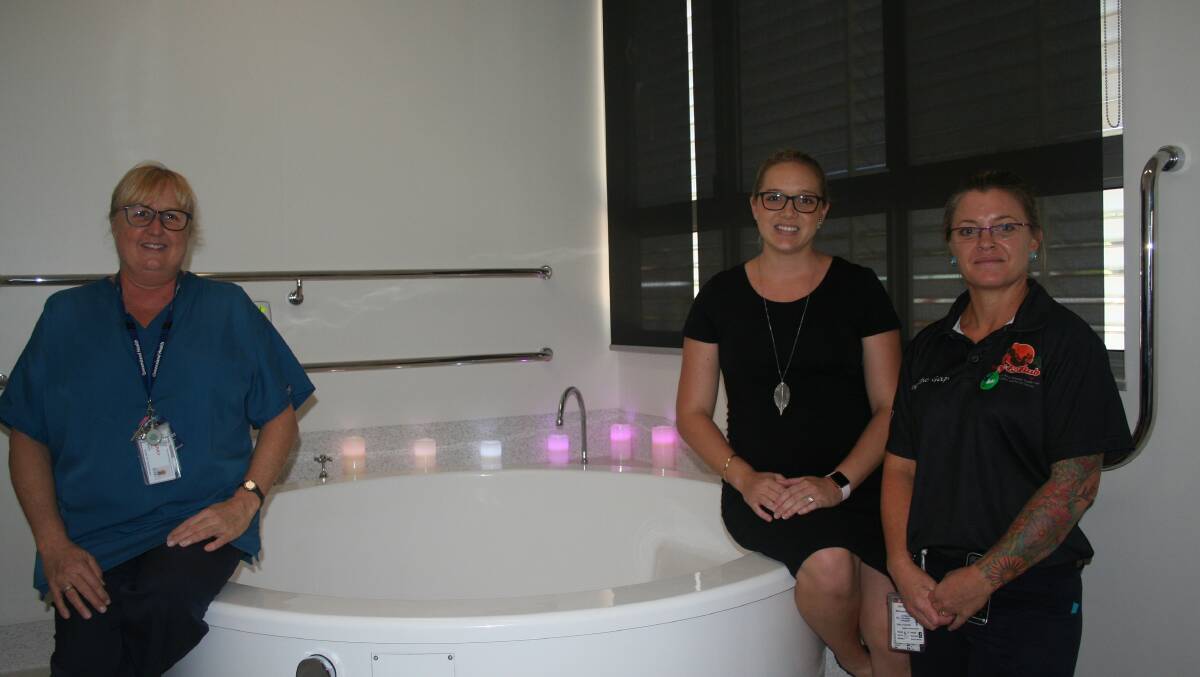 BATH PAIN RELIEF: Nurse Unit Manager Kerry Owens, expectant mum, Jenna Nastasi and midwife, Rachel Taylor at the pain relief bath.