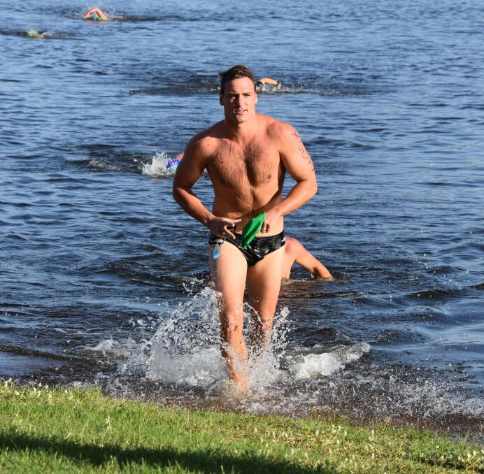 SWIM LEG: First team member out of the water during the swim leg was James Stewart. Photos: Melissa North