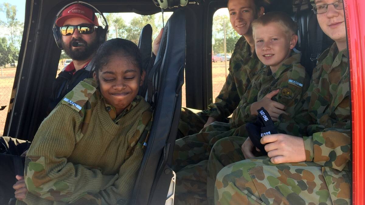 Cadets Ryan Hardie, Jaxson Mulholland, Malvika Naidu and Thomas norton were thrilled to be part of the 25-minute flight over the skies of Mount Isa. Photos: Supplied