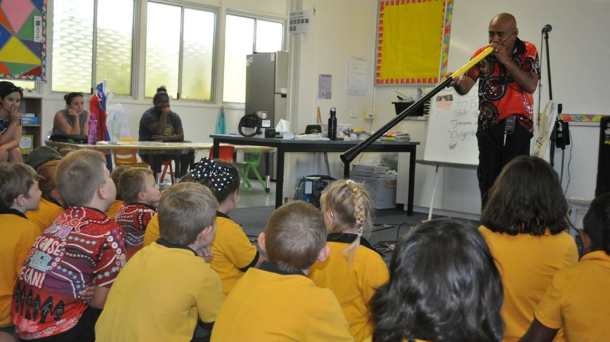 DIDJERIBONE: Tupurru demonstrated how to slide the instrument to the students at Boulia State School. Photo: Supplied