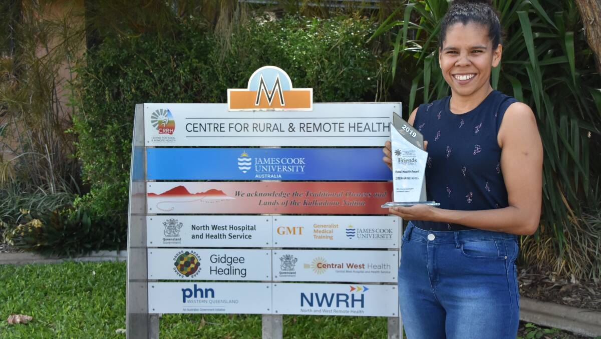 AWARD: Stephanie King, a research officer from the Centre for Rural and Remote Health displays her award. Photo: Samantha Walton