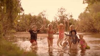 The children at Julia Creek were filmed horse riding, motorbike riding and enjoying themselves for the town's new song.