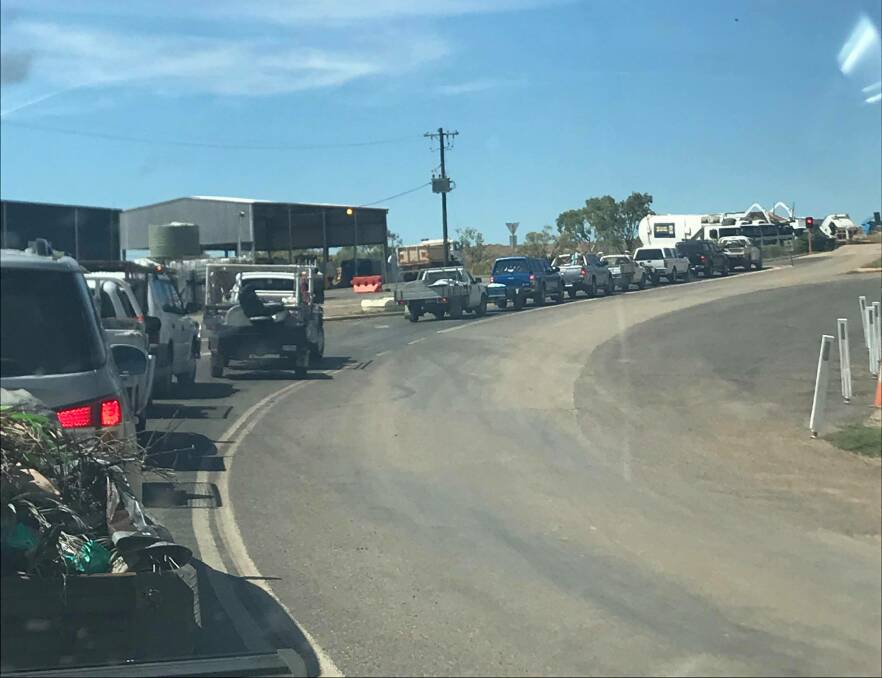 AMNESTY DAY: The line up to the front gate of the Waste Refuse Facility was long in both directions. Photo: Bianca Coleman