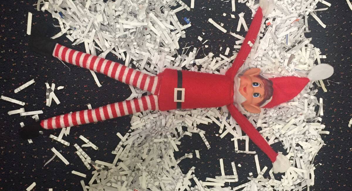 ELROY THE ELF: Makes a snow angel at Elders Insurance Mount Isa. Photos: Supplied