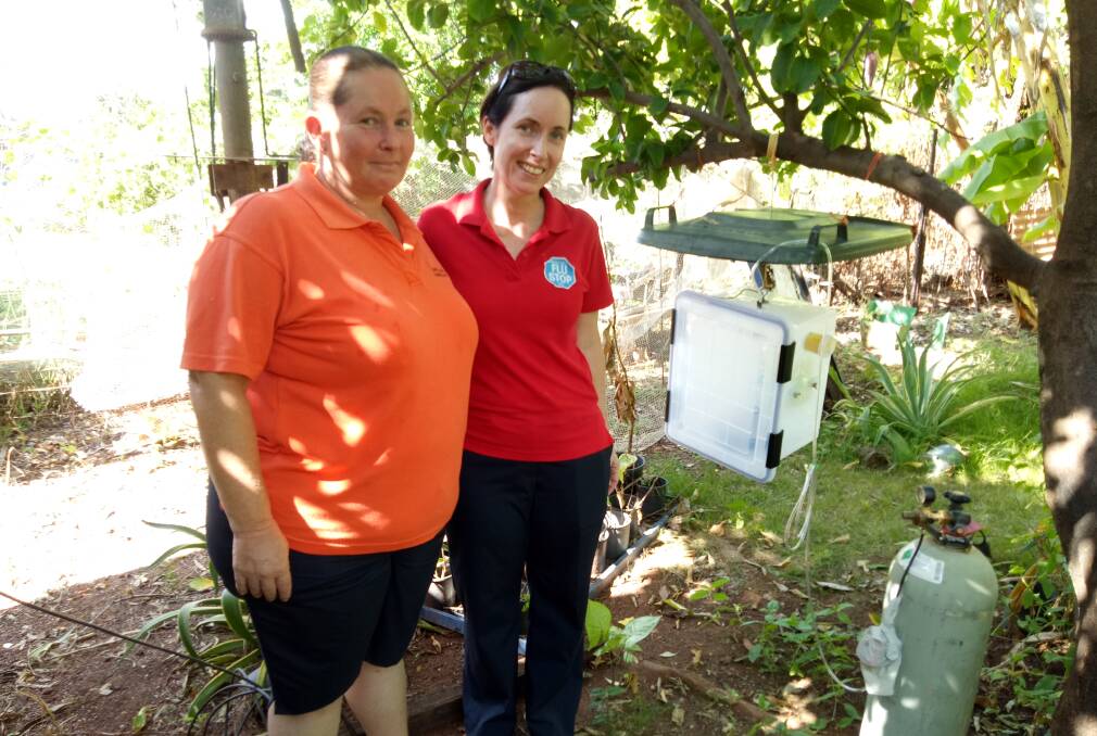 MOSSIE SPIT: Katherine Stock, Director of Nursing and Michana Bell, Operations Officer at Normanton Hospital, monitor the Normanton trap.