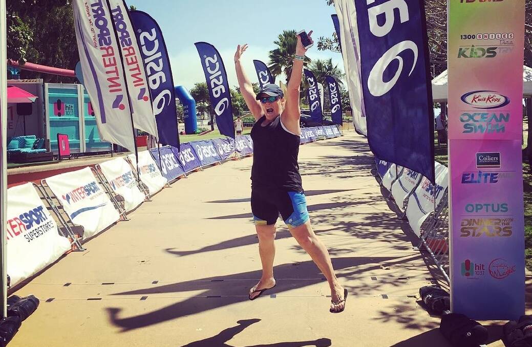 STOPPED SMOKING: Andrea Wallace jumping for joy after finishing the Townsville Triathlon.
