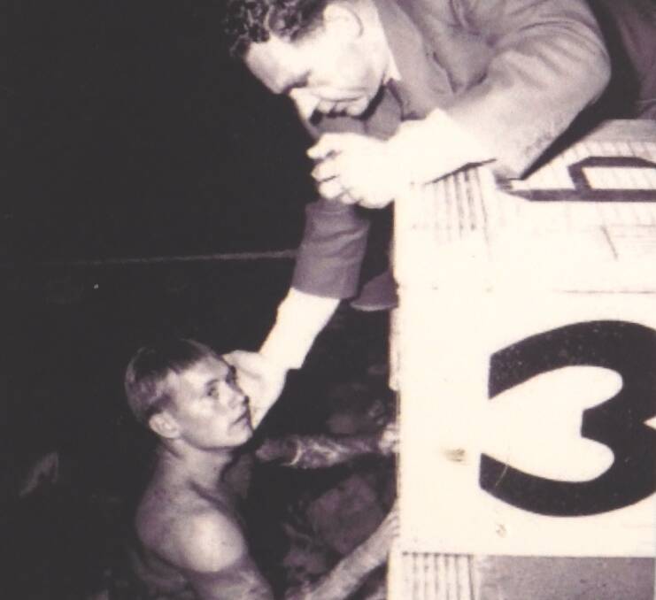 Olympian: A young Bill Burton gets checked by a doctor after finishing a lap.