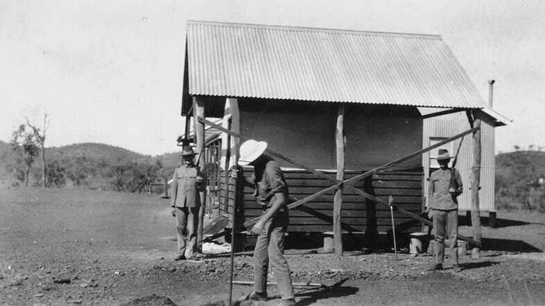 EARLY DAYS: Constable Queale putting up his tent in front of the Mount Isa Police station in 1929. 