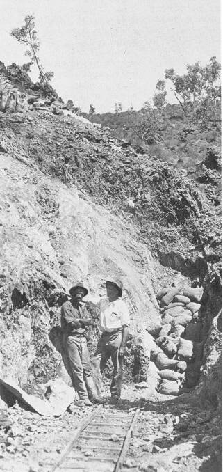 ISA FOUNDERS HISTORY:Miles and MacGillivray on the racecourse outcrop in 1923 on John Campbell Miles mine which he named 'Mount Isa' on his lease application. 