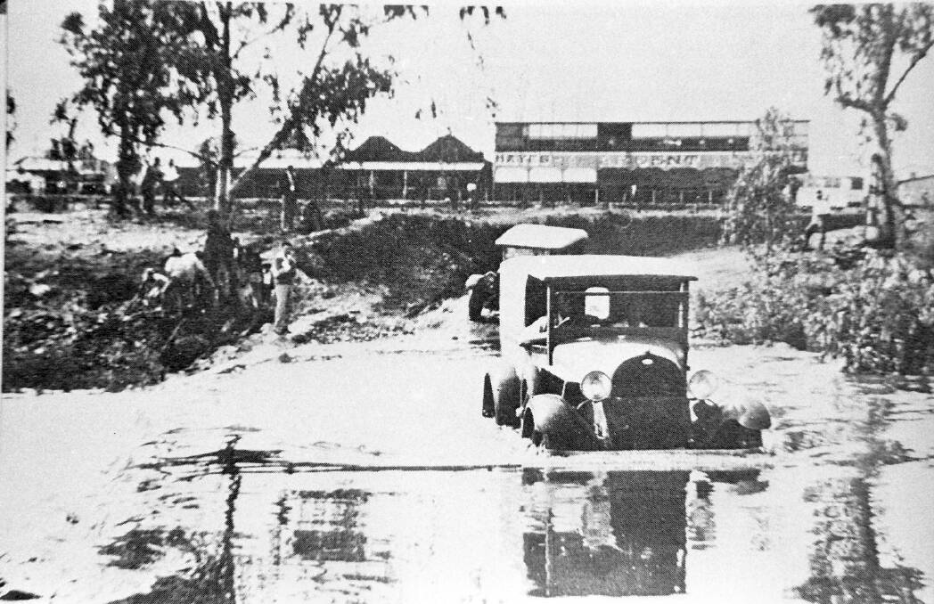 BIG WET: The arrival of the wet with the Leichhardt River, the next problem was getting the bread to the miners barracks in early the early 1930s. 