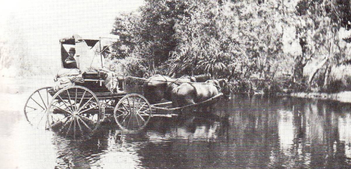 TRAVELLING TEACHER: Camooweal itinerant teacher Lionel Saunders crossing the water 1918. 