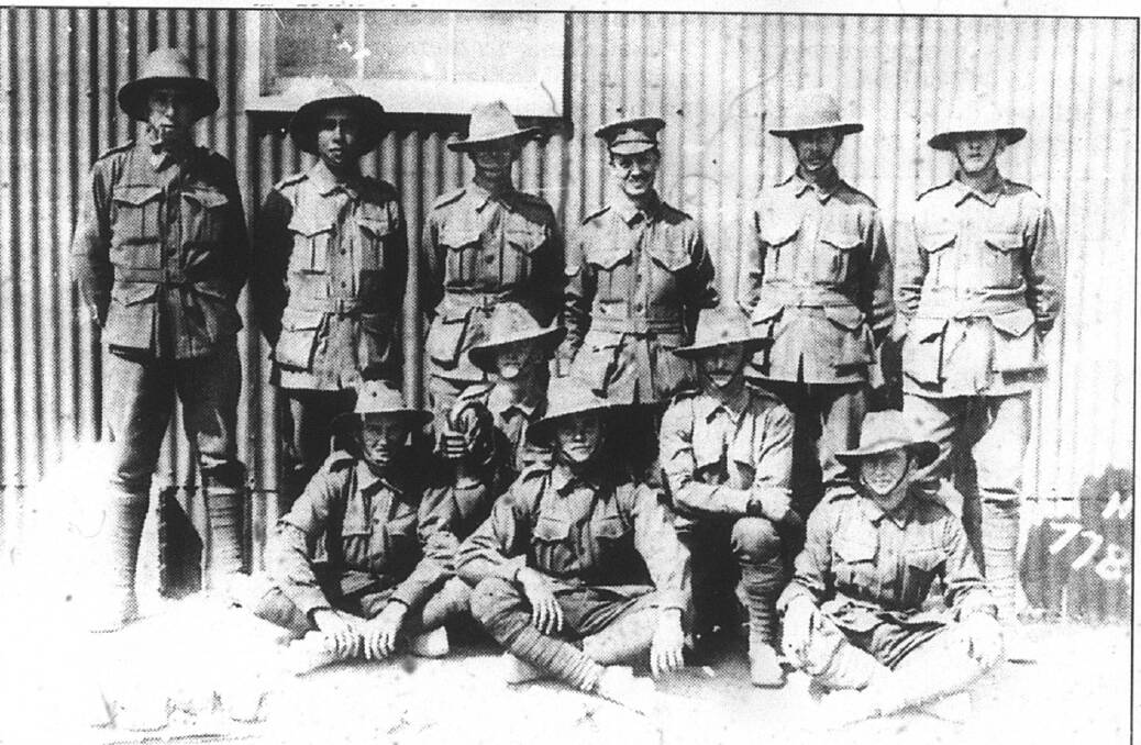 VOLUNTEER: Peter Craigie (back row second from the left) before leaving for France in 1916. In the centre of the front is his Mount Isa friend.