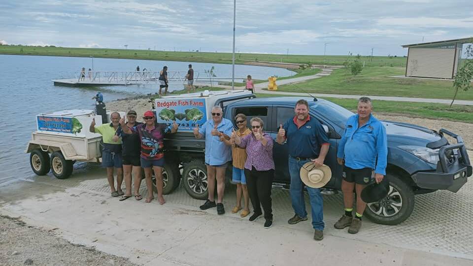 Locals get ready to release fingerlings and Red Claw into the Hughenden Recreational lake. Photo supplied.
