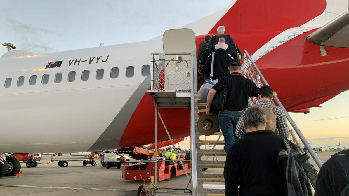 ALL ABOARD: Passengers board the Brisbane to Mount Isa flight. Photo: Samantha Campbell.