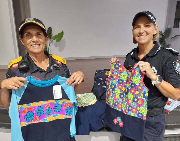 Police Liaison Officer Roneece Cupitt and Sergeant Bernadette Strow display some items created by Uniforms 4 Kids. Photo supplied