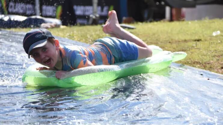 William cools down on a slip and slide at Lake Moondarra in Mount Isa, 120 kilometres west of Cloncurry.