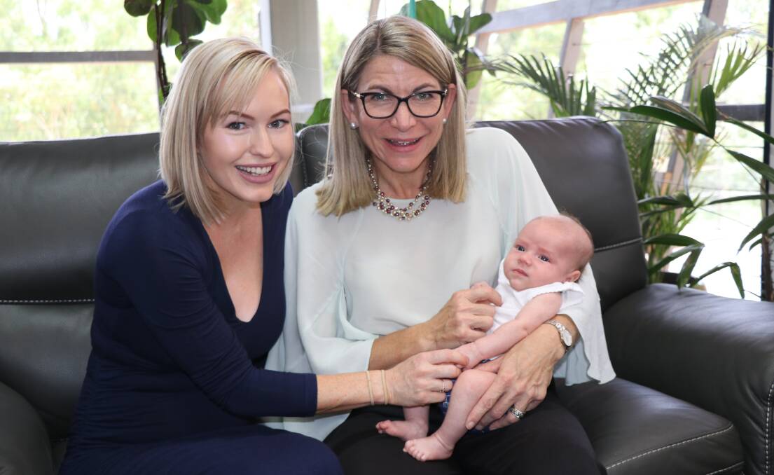 New first-time mum Kate Te Wharau with her little bundle of joy Archer and Mayor Joyce McCulloch.
